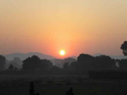 SUNRISE AT TRIBAL VILLAGE IN RAYAGADA